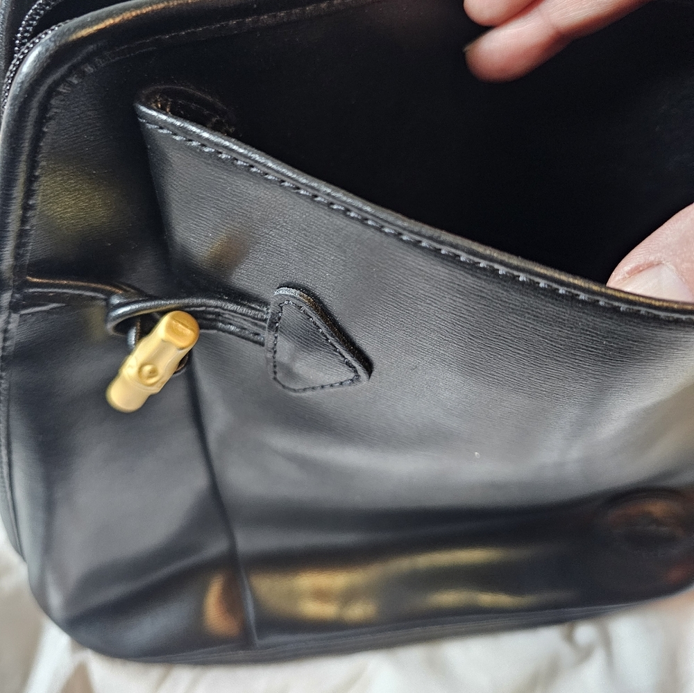 Vintage LONGCHAMP black leather sling bag.  10in by 12in.